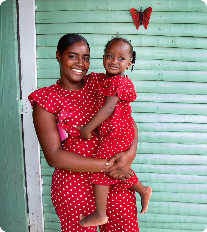 A smiling mother holding her happy child.